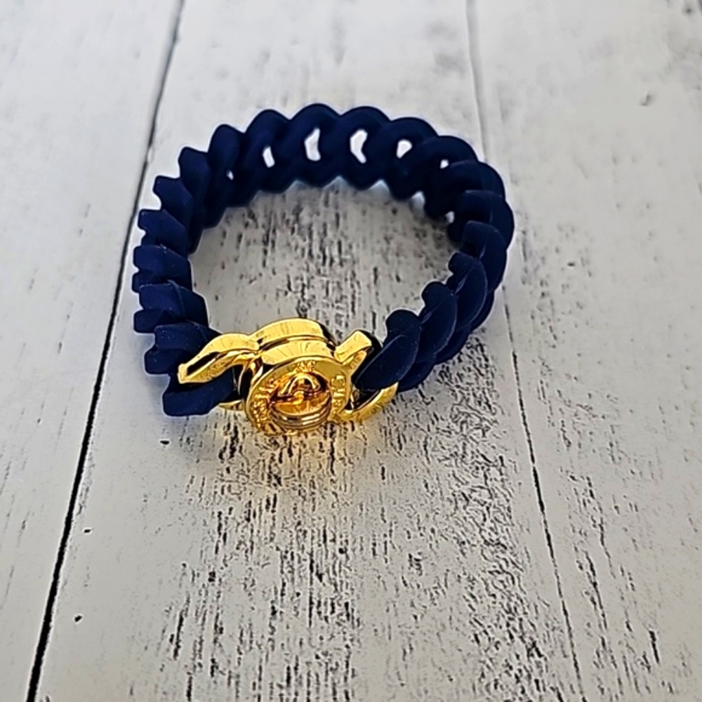 RUSTIC CUFF BLUE RUBBER BRACELET WITH GOLD CLOSER.